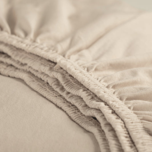 Hoeslaken jersey licht zand